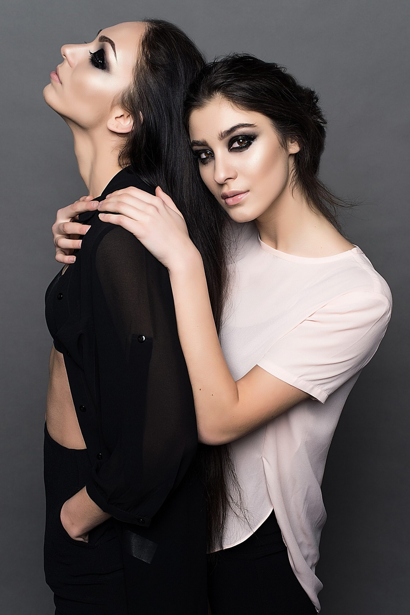 woman-in-white-crew-neck-t-shirt-embracing-woman-in-black-160599-scaled-1-1.jpg