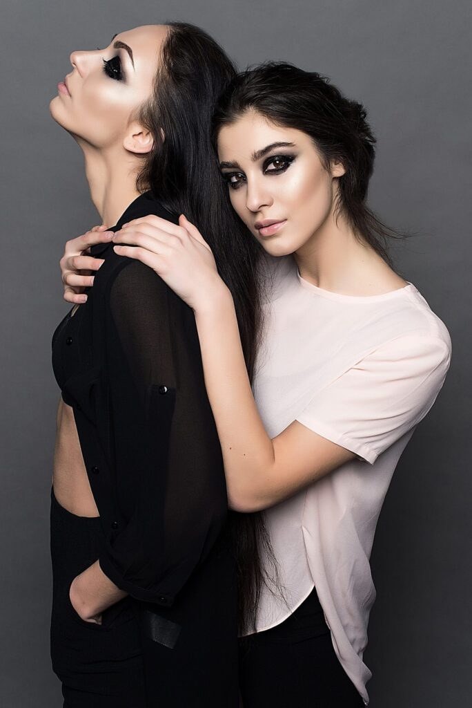 woman-in-white-crew-neck-t-shirt-embracing-woman-in-black-160599-scaled.jpg